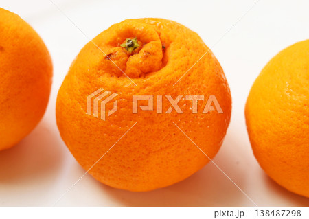 Four fresh Sumo oranges placed on a white background. Four fresh Sumo oranges placed on a white background. 138487298