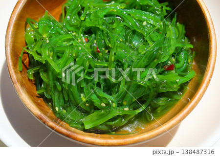 Fresh green seaweed salad with sesame seeds Fresh green seaweed salad with sesame seeds 138487316