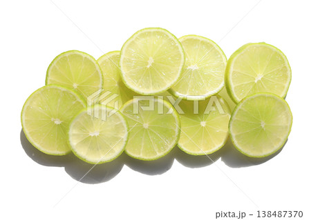 Fresh green lime slices on whiate background. Fresh green lime slices on whiate background. 138487370