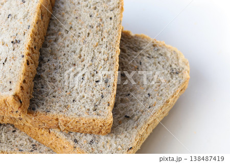 Whole wheat bread slices for a healthy breakfast. Whole wheat bread slices for a healthy breakfast. 138487419