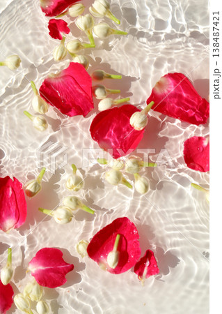rose petals and jasmine scattered in rippling water, Songkran festival background. 138487421