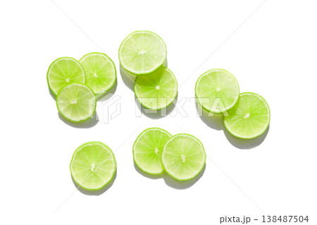 Fresh green lime slices on whiate background. Fresh green lime slices on whiate background. 138487504