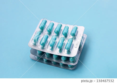 Blue capsules of Doxycycline in blister packs. 138487532