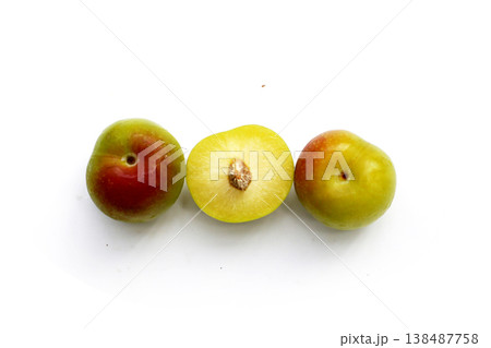 Fresh green plum fruit on white background. 138487758
