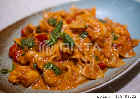 Farfalle pink sauce with prawn served on plate. It is a pasta shaped like butterfly or bow tie 138488322