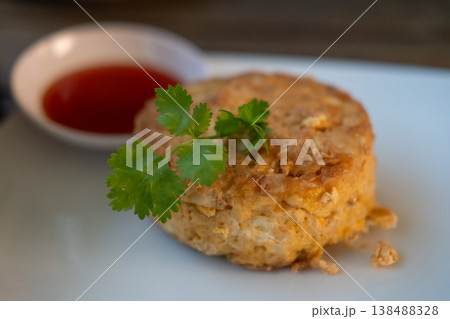Omelet with crab meat served with sauce, on plate Omelet with crab meat served with sauce, on plate 138488328