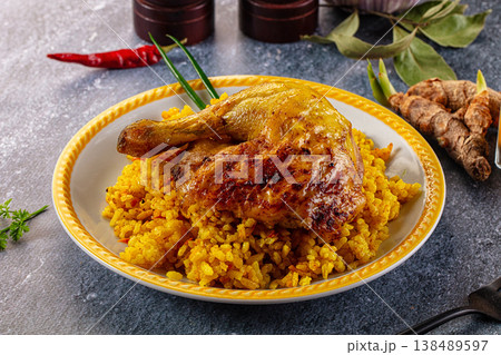 Roasted chicken leg with yellow rice Roasted chicken leg with yellow rice 138489597