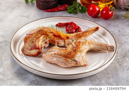 Roasted rabbit leg served rosemary 138489704