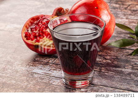 Sweet fresh pomegranate juice glass Sweet fresh pomegranate juice glass 138489711