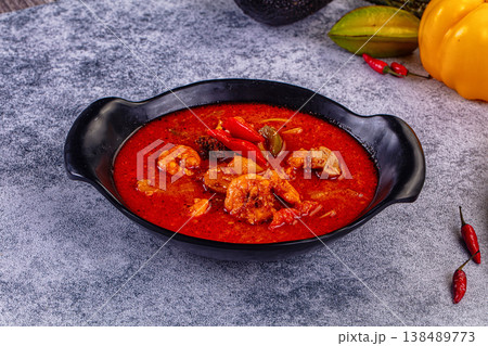Spicy shrimp soup Red Thai Curry  with prawns and vegetables in a vibrant red broth. Asian cuisine concept. 138489773