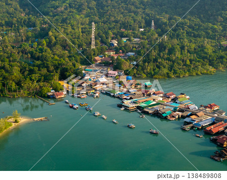 Top down aerial view of wooden houses and walkways in Bang Bao village, Thailand. Unique coastal architecture. 138489808