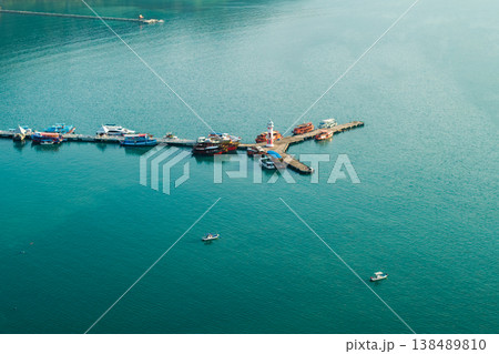 High angle aerial view of coral reefs under crystal clear turquoise water in Ko Chang, Thailand. Tropical sea bottom. 138489810