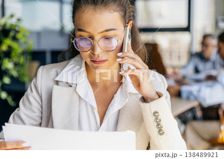 Operations director finalizing contract details on call 138489921