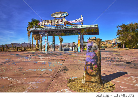 Abandoned Lake Dolores Water Park Entrance with Graffiti Palm Trees and Desert Landscape Abandoned Lake Dolores Water Park Entrance with Graffiti Palm Trees and Desert Landscape 138493372
