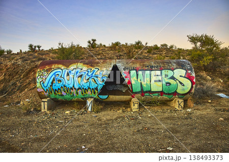 Graffiti Covered Tank in Mojave Desert California with Abandoned Industrial Vibe Graffiti Covered Tank in Mojave Desert California with Abandoned Industrial Vibe 138493373