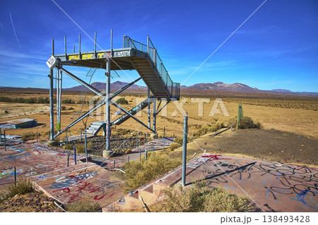Abandoned Water Slide Platform Graffiti and Desert Landscape at Lake Dolores California Abandoned Water Slide Platform Graffiti and Desert Landscape at Lake Dolores California 138493428