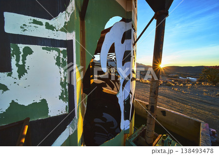 Graffiti Art on Abandoned Goldome Mill with Sunburst at Mojave Desert Golden Hour Graffiti Art on Abandoned Goldome Mill with Sunburst at Mojave Desert Golden Hour 138493478