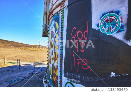 Graffiti Art on Abandoned Metal Structure in Sunlit California Desert Graffiti Art on Abandoned Metal Structure in Sunlit California Desert 138493479