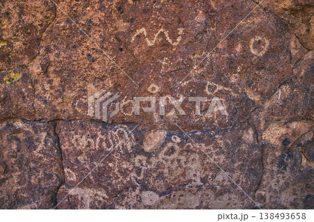 Ancient Petroglyphs on Desert Rock Surface Mojave California History Texture Ancient Petroglyphs on Desert Rock Surface Mojave California History Texture 138493658