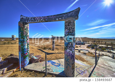 Graffiti Covered Entrance Pillars and Deserted Lake Dolores Water Park Ruins California 138493687
