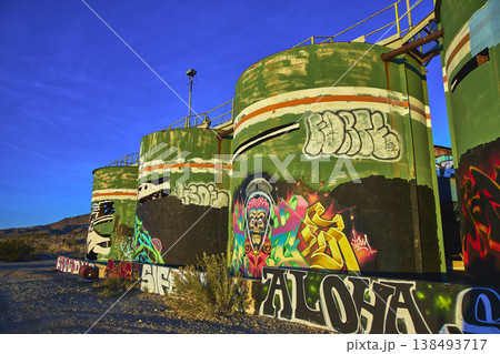 Graffiti Art on Abandoned Industrial Tanks in Desert at Goldome Mill California 138493717