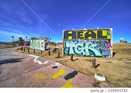 Graffiti Art and Abandoned Water Park Structures in Sunlit California Desert Graffiti Art and Abandoned Water Park Structures in Sunlit California Desert 138493785