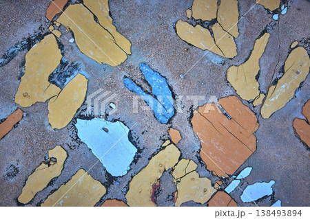 Textured Cement Surface With Peeling Blue Yellow And Orange Paint Abstract Textured Cement Surface With Peeling Blue Yellow And Orange Paint Abstract 138493894