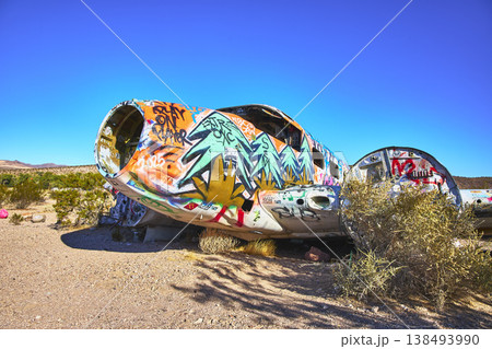 Graffiti Covered Abandoned Airplane Fuselage in Desert Near Beatty Nevada Graffiti Covered Abandoned Airplane Fuselage in Desert Near Beatty Nevada 138493990