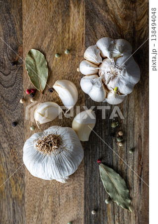Garlic Cloves on Rustic Wood 138494048