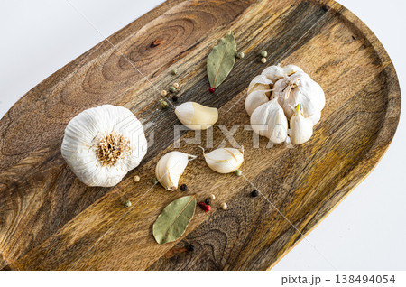 Organic Garlic Bulbs on Cutting Board Organic Garlic Bulbs on Cutting Board 138494054
