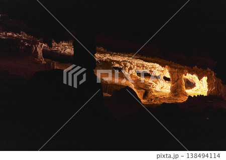 Cave Interior With Dramatic Light Painting Illuminating Stalactites And Rock Formations Cave Interior With Dramatic Light Painting Illuminating Stalactites And Rock Formations 138494114