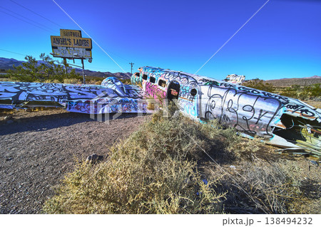 Graffiti Covered Abandoned Airplane and Brothel Sign in Nevada Desert Near Beatty 138494232