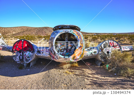 Abandoned Airplane with Colorful Graffiti in Nevada Desert near Beatty Abandoned Airplane with Colorful Graffiti in Nevada Desert near Beatty 138494374