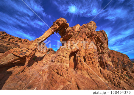 Elephant Rock Formation and Red Sandstone Cliffs Under Vibrant Blue Sky Valley of Fire Elephant Rock Formation and Red Sandstone Cliffs Under Vibrant Blue Sky Valley of Fire 138494379