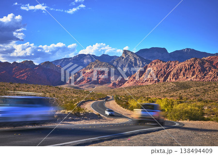 Red Rock Canyon Scenic Highway Cars and Desert Mountains at Golden Hour Red Rock Canyon Scenic Highway Cars and Desert Mountains at Golden Hour 138494409