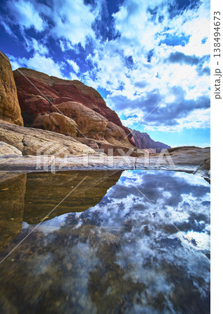 Red Rock Canyon Calico Sandstone Mountain Water Reflection and Dramatic Sky 138494673