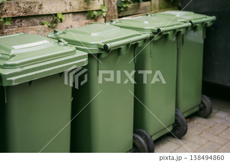 Colorful recycling bins on city street 138494860
