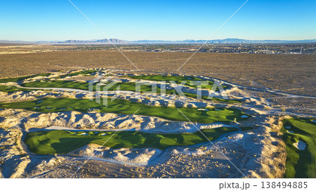 Aerial Las Vegas Golf Course Desert Landscape and Distant City Skyline Aerial Las Vegas Golf Course Desert Landscape and Distant City Skyline 138494885