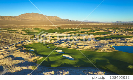 Aerial Golf Course Green Fairways and Desert Landscape at Golden Hour Las Vegas Nevada Aerial Golf Course Green Fairways and Desert Landscape at Golden Hour Las Vegas Nevada 138495032