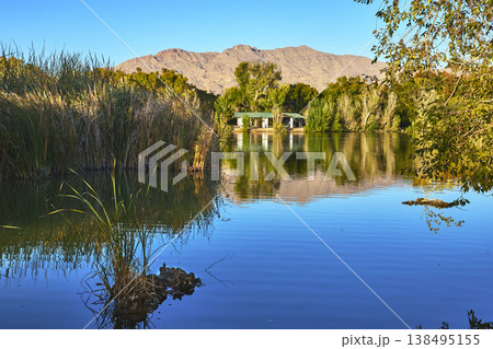 Golden Hour Pond Reflections and Mountain Landscape at Floyd Lamb Park Las Vegas Golden Hour Pond Reflections and Mountain Landscape at Floyd Lamb Park Las Vegas 138495155