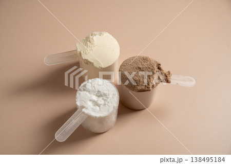 Collagen, creatin or protein powder in scoops. Food supplement, fitness sport, health and nutrition. 138495184