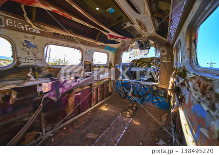 Abandoned Airplane Interior Graffiti Art and Desert Sunlight in Beatty Nevada 138495220
