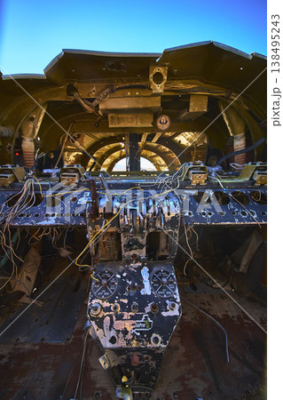 Abandoned Airplane Cockpit with Graffiti and Exposed Wiring in Desert Sunlight Abandoned Airplane Cockpit with Graffiti and Exposed Wiring in Desert Sunlight 138495243