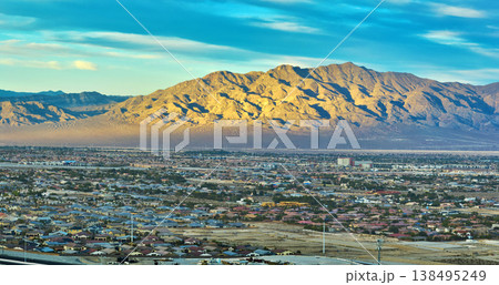 Aerial Las Vegas Suburban Neighborhoods and Sunlit Nevada Mountains Panorama Aerial Las Vegas Suburban Neighborhoods and Sunlit Nevada Mountains Panorama 138495249