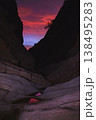Vivid Blue Hour Light Over Dramatic Slot Canyon Rock Walls and Reflective Pools 138495283