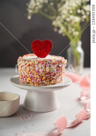 Valentine's Day, Love, festive cake with red heart and gypsophila flowers Valentine's Day, Love, festive cake with red heart and gypsophila flowers 138495309