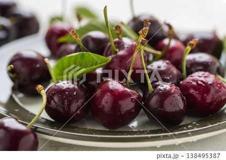 Fresh cherries fruits in a plate, macro photography, summer fruits. Abstract fruit food photo 138495387