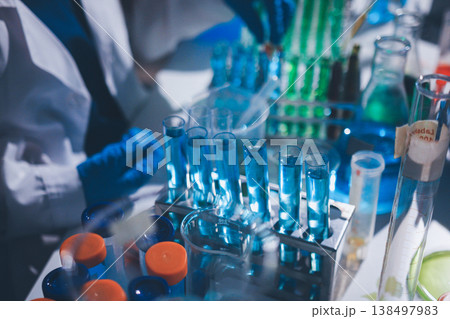 Science, laboratory and woman with pipette, test tube and biotech solution in research. Medical innovation, scientist or lab technician in study for healthcare, medicine and vaccine results feedback. Science, laboratory and woman with pipette, test tube and biotech solution in research. Medical innovation, scientist or lab technician in study for healthcare, medicine and vaccine results feedback. 138497983