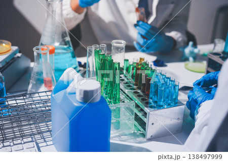 Science, laboratory and woman with pipette, test tube and biotech solution in research. Medical innovation, scientist or lab technician in study for healthcare, medicine and vaccine results feedback. Science, laboratory and woman with pipette, test tube and biotech solution in research. Medical innovation, scientist or lab technician in study for healthcare, medicine and vaccine results feedback. 138497999