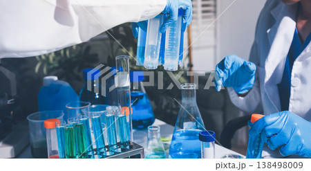 Science, laboratory and woman with pipette, test tube and biotech solution in research. Medical innovation, scientist or lab technician in study for healthcare, medicine and vaccine results feedback. Science, laboratory and woman with pipette, test tube and biotech solution in research. Medical innovation, scientist or lab technician in study for healthcare, medicine and vaccine results feedback. 138498009